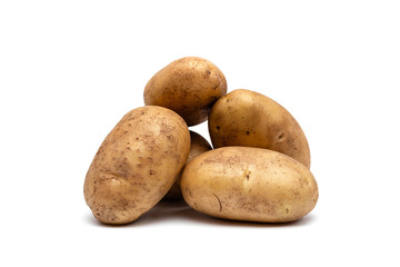 raw dirty potatoes on a white background