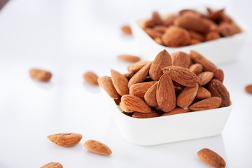 Group of almonds on white background