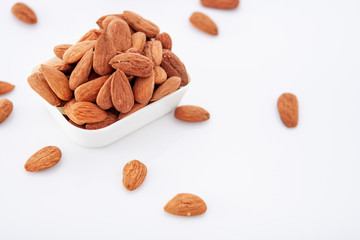 Group of almonds on white background