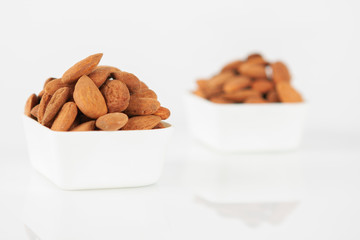 Group of almonds on white background
