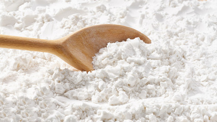 Background of corn starch flour powder texture close-up.