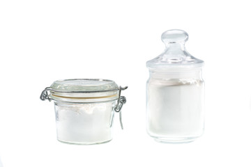 Glass jar with corn  starch isolated on a white background.