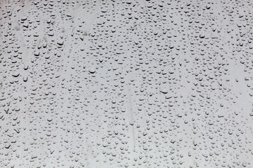 Water Drops on Gray Metal Background