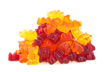Assortment of colorful and bright fruity flavor Gummy Bears isolated on a white background. Heap of...