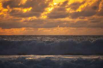 Fototapeta na wymiar Magical dramatic sunset on a tropical beach.
