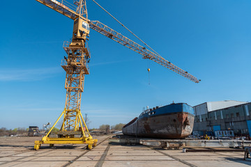 Fototapeta na wymiar shipyard workers are working in the hangar to build a new ship