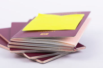 A stack of red passports and Note Flight Cancelled isolated on White Background . Travel concept.