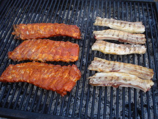 Ribs on grill, simple and marinated, above extinguished coals