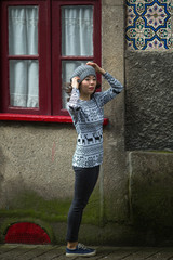 Beautiful young asian woman on a street in old town.