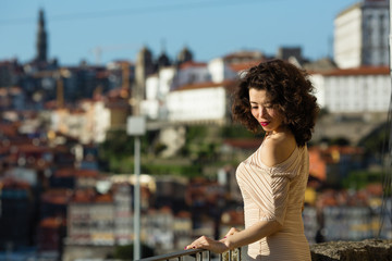 Beautiful mixed-race asian woman on a street in old Porto downtown. Multicultural Portugal.