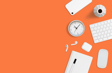 Colorful flat layout of workplace on orange background