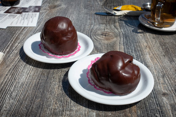 Bossche Bol, typical Dutch pastry with chocolate and cream from the city of Den Bosch