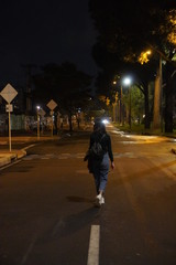 woman walking on the street at night