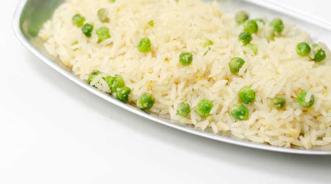 Egg fried rice served on the metal tray, an addition to an Indian or Asian main course