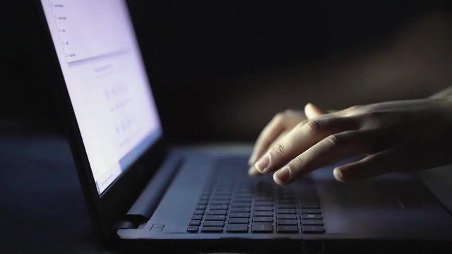 girl hands typing on a laptop keyboard searching on a search engine
