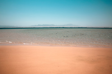 Summer photo of beach with sea and sunny warm day 