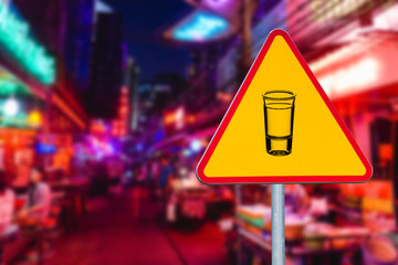 Party zone sign. Have a good fun street background. Vodka shot shape symbol. Yellow triangle street sign with red frame.