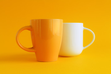 Teacups on yellow background