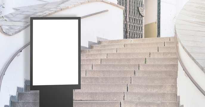 Empty Citylight With Space For Advertisement On Stone Steps In City Center