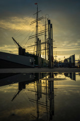 silhouette of a sailing ship at sunset