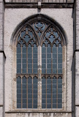 Pointed ogive arch with gothic window at the facade of Goes city church in the Netherlands