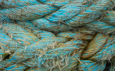 Close up of worn mooring ropes.