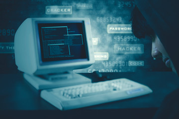 Unknown man sitting in front of computer