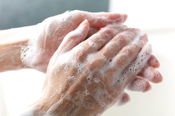 Fototapeta premium Washing hands. daily personal care against viruses, bacteria, microbes.