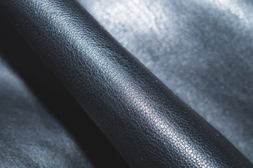 Black leather macro. rough material abstract background