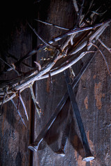 Top view of bloody nails and crown of thorns as symbol of crucifixion of Jesus Christ. Vertical image.
