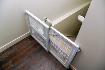 Baby gate at top of staircase
