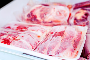 Closeup of plastic wrapped red meat packages