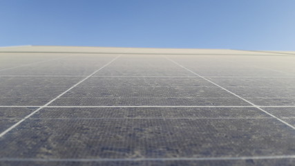 close-up and detail of sand, dust and dirt on a solar panel impacting the efficiency of solar electricity power generation