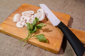 Champignons on a cutting board. Tasty and healthy food.