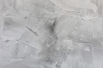 Light gray rough concrete wall or stucco texture background