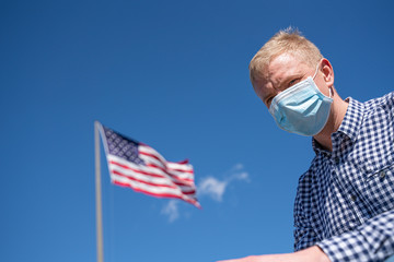 Portrait of young American man wearing protective mask against the coronavirus