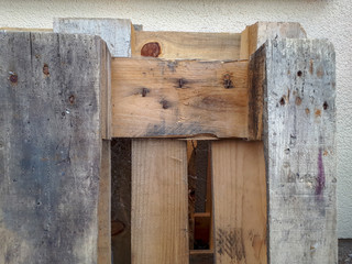 old wooden euro palette against wall 