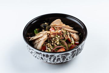 Wok with chicken breast, onion, greens and mushrooms isolated on white for a menu
