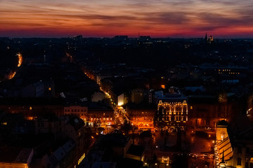 View on illuminated Latin cathedral and historic center of the Lviv at sunset. View on Lvov cityscape from the town hall