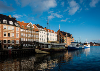 Famous old harbour with boats and colorful old buildings in Copenhagen