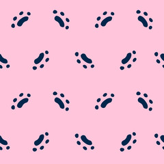 Seamless pattern of pink color with cat paws. Abstract background with hand drawn elements: cat paws, footprints. Colorful vector illustration.