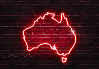 Neon sign on a brick wall in the shape of Australia.(illustration series)