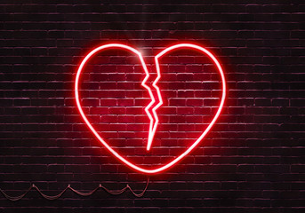 Neon sign on a brick wall in the shape of a broken heart.(illustration series)