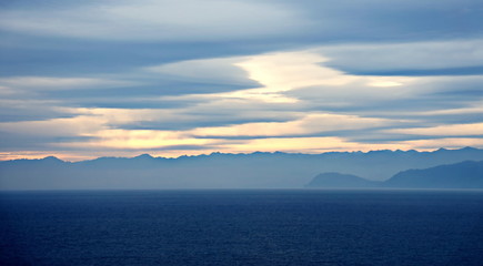 Thunderclouds and rain clouds over the coastline of the Strait of Juan de Fuca. Pacific Ocean.
