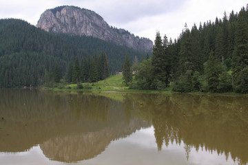 Fototapeta na wymiar Lacu Rosu and Suhardul Mic peak, Romania