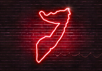 Neon sign on a brick wall in the shape of Somalia.(illustration series)