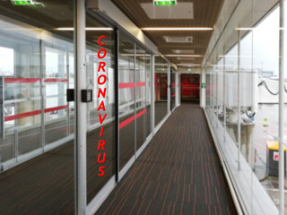 Empty gallery at the airport, text - coronavirus. The concept of the global coronavirus epidemic, quarantine.