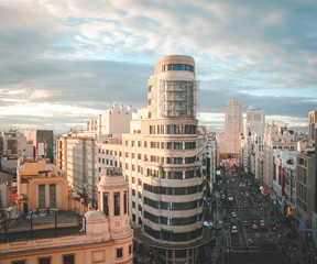 Gran via street with traffic and people and Callao Square, main shopping street in Madrid. Spain, Europe
