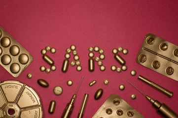 template of sars word and blister packs on pink background
