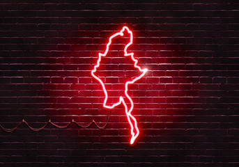 Neon sign on a brick wall in the shape of Burma.(illustration series)